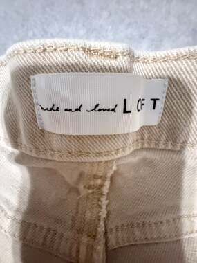 Loft cream jeans with fringe bottoms